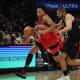 Toronto Raptors forward Scottie Barnes (4) moves the ball against Los Angeles Clippers forward Nicolas Batum (33) during the second half at Crypto.com Arena